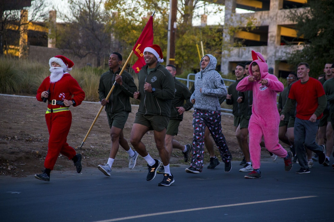 U.S. Marines and Sailors with 7th Engineer Support Battalion, 1st Marine Logistics Group, participate in a battalion holiday run at Camp Pendleton, Calif., Dec. 22, 2017. The Marines and Sailors of 7th ESB wore festive clothing in celebration of the holidays.