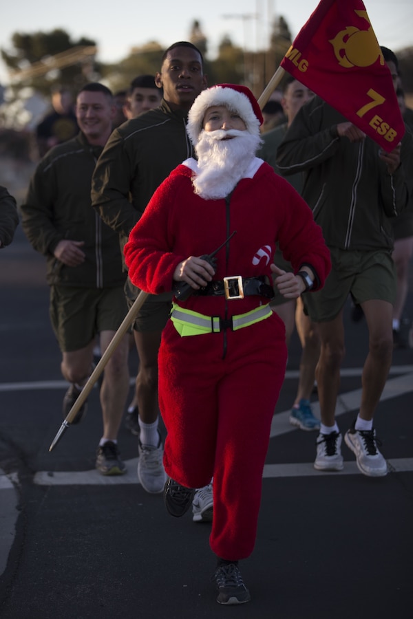 U.S. Marine Lt. Col. Jennifer Nash, the commanding officer for 7th Engineer Support Battalion, 1st Marine Logistics Group, leads her Marines during the 7th ESB Holiday Run at Camp Pendleton, Calif., Dec. 22, 2017. Marines within the unit were encouraged to dress up in their best holiday attire during the run.