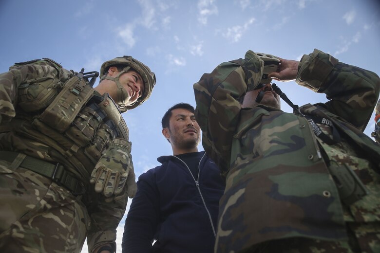 An Afghan Air Force tactical air controller scouts notional targets for MD-530 helicopters during an ATAC training exercise at Camp Shorabak, Afghanistan, Dec. 18, 2017. Several ATACs worked with coalition advisors to execute simulated airstrikes in preparation for upcoming operations in Helmand province. This capability allows for the Afghan Air Force to use organic air assets to destroy Taliban targets, giving other Afghan National Defense and Security Forces increased security and freedom of movement on the battlefield. (U.S. Marine Corps photo by Sgt. Lucas Hopkins)