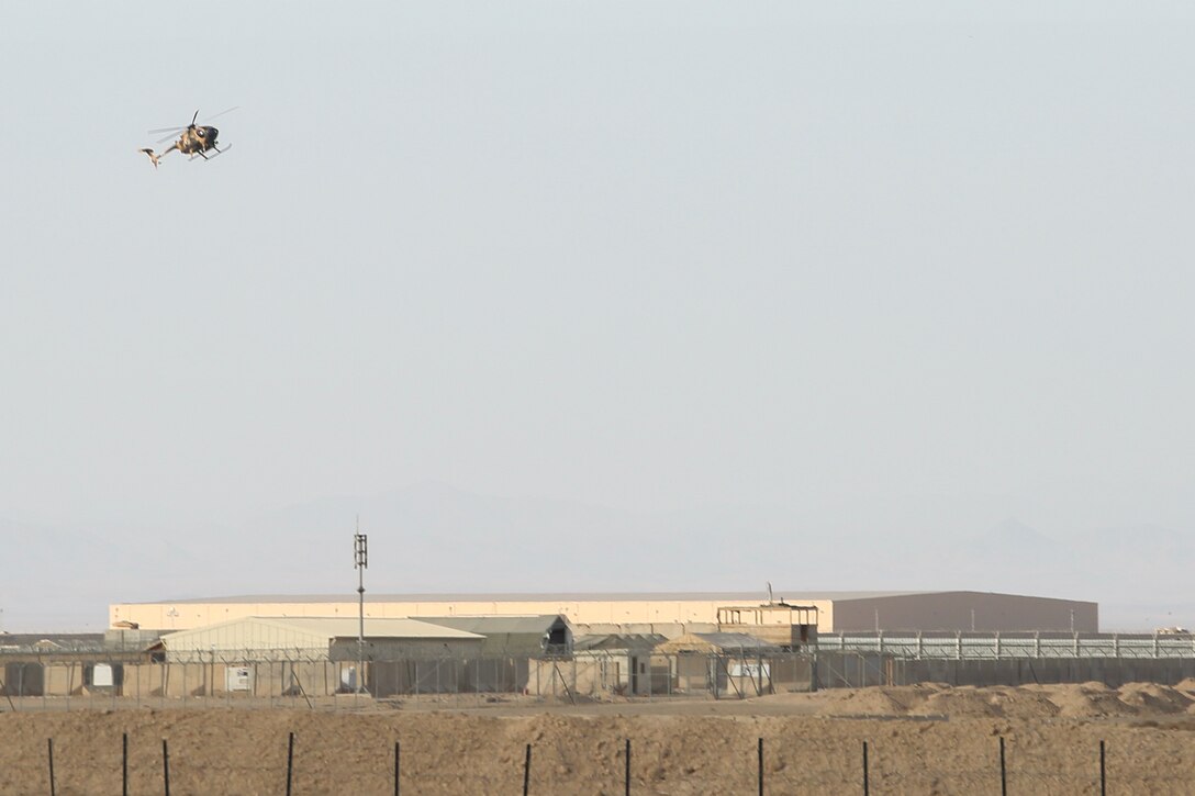 An Afghan Air Force MD-530 helicopter flies above Camp Shorabak, Afghanistan as Afghan tactical air controllers conduct simulated airstrike training Dec. 18, 2017. The exercise enabled several ATACs to rehearse their aircraft directing skills alongside coalition advisors in preparation for future combat operations. Coordinating airstrikes on the battlefield allows for Afghan National Defense and Security Forces increased freedom of movement and ability to destroy and exploit Taliban strongholds. (U.S. Marine Corps photo by Sgt. Lucas Hopkins)