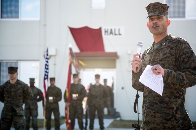 Colonel Giles R. Boyce, the commanding officer for Headquarters Battalion, 3rd Marine Division, renames the staff non-commissioned officer barracks on Camp Courtney, Okinawa, Japan, Dec. 22, 2017. Dorris Hall is named after the Navy Cross recipient, Staff Sgt. Claude H. Dorris, a squad leader with the Combined Action Program during the Vietnam War, who went above and beyond the call of duty.