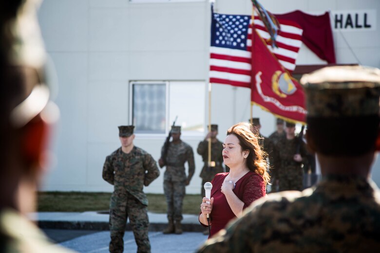 Chikako McMasters, the daughter of Staff Sgt. Claude H. Dorris, speaks at the renaming of the staff non-commissioned officer barracks on Camp Courtney, Okinawa, Japan, Dec. 22, 2017. Dorris Hall is named after Dorris, a squad leader with the Combined Action Program during the Vietnam War, who received the Navy Cross for going above and beyond the call of duty.