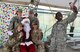 Airmen take a photo with Santa Claus at the 407th Air Expeditionary Group in Southwest Asia Dec. 20, 2017. The 407th AEG put together a small holiday celebration for people to see Santa Claus and receive stockings. (U.S. Air Force photo by Staff Sgt. Joshua Edwards/Released)