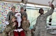 Airmen take a photo with Santa Claus at the 407th Air Expeditionary Group in Southwest Asia Dec. 20, 2017. The 407th AEG put together a small holiday celebration for people to see Santa Claus and receive stockings. (U.S. Air Force photo by Staff Sgt. Joshua Edwards/Released)