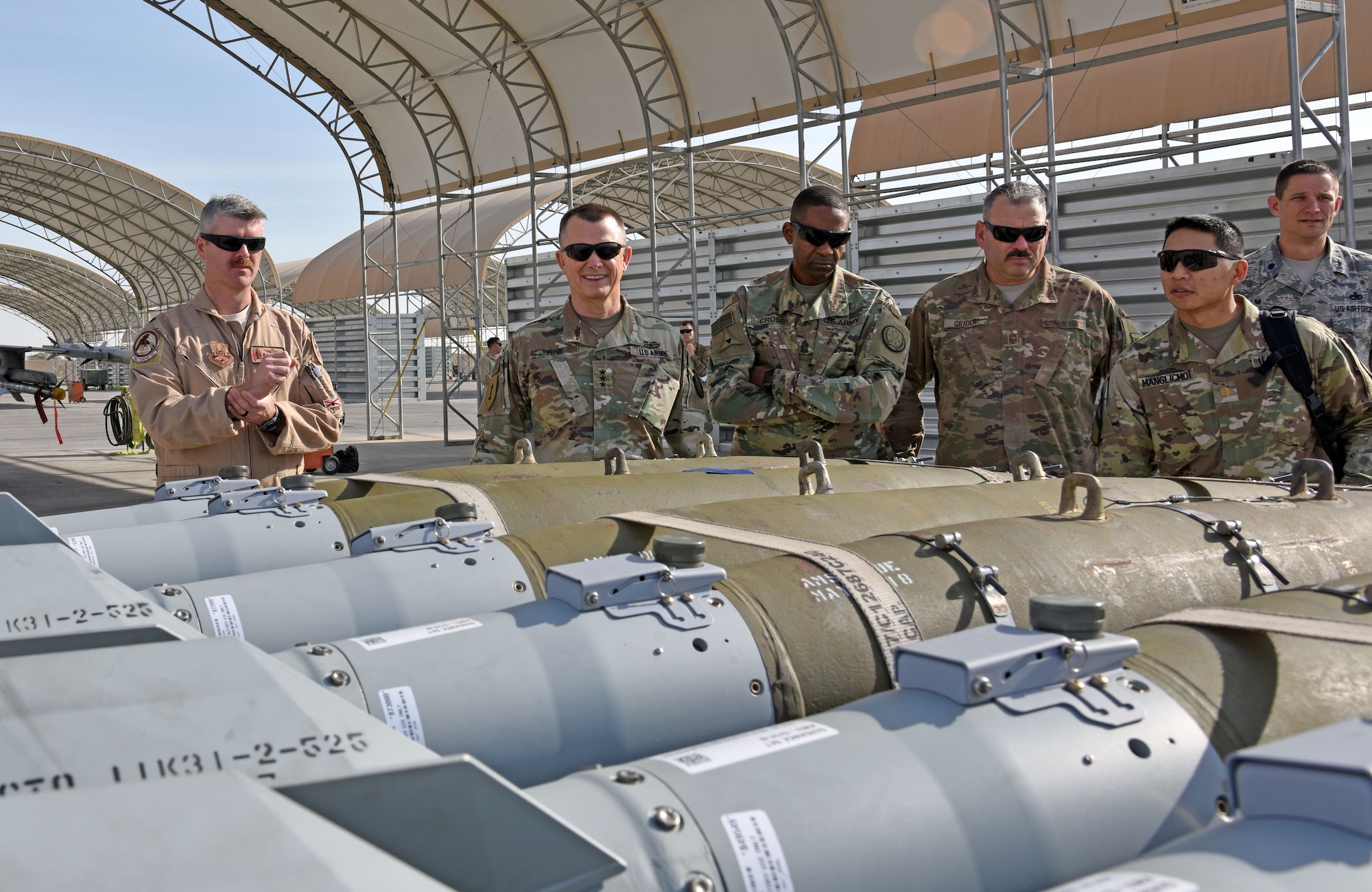U.S. Army Lt. Gen. Paul Funk II, Combined Joint Task Force – Operation INHERENT RESOLVE commanding general, views F-16 Fighting Falcon weaponry at the 407th Air Expeditionary Group in Southwest Asia, Dec. 23, 2017. While visiting the 407th AEG, Funk met with the 100th Expeditionary Fighter Squadron to talk about their operations in Southwest Asia. (U.S. Air Force photo by Staff Sgt. Joshua Edwards/Released)