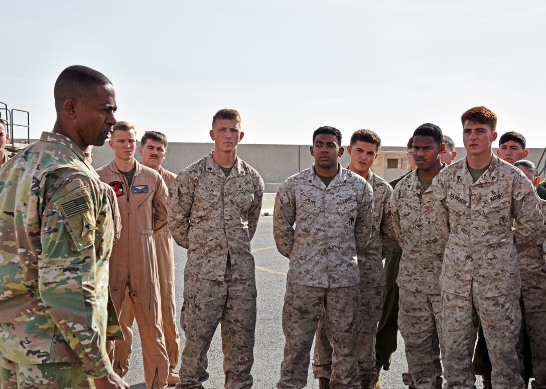 U.S. Army Command Sgt. Maj. Michael Crosby, Combined Joint Task Force – Operation INHERENT RESOLVE senior enlisted advisor, speaks with Marines at the 407th Air Expeditionary Group in Southwest Asia, Dec. 23, 2017. Crosby and U.S. Army Lt. Gen. Paul Funk II, CJTF – OIR commanding general, visited with 407th AEG personnel, sister services and coalition partners as they discussed current operations in Southwest Asia. (U.S. Air Force photo by Staff Sgt. Joshua Edwards/Released)