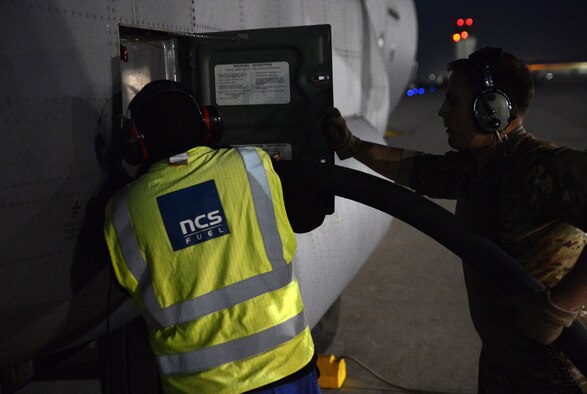 A C-130J Super Hercules from the 774th Expeditionary Airlift Squadron receives fuel from a fuel truck during a wet-wing mission Dec. 10, 2017 at Kandahar Airfield, Afghanistan.