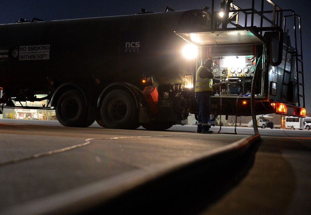 A fuel truck fuels a C-130J Super Hercules during a wet wing mission Dec. 10, 2017 at Kandahar Airfield, Afghanistan.