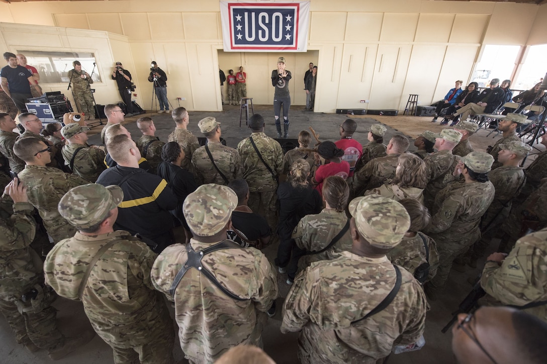 A celebrity comedian speaks to service members.