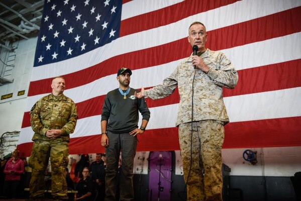 Marine Corps Gen. Joe Dunford, chairman of the Joint Chiefs of Staff, introduces Medal of  Honor recipient retired U.S. Army Capt. Florent Groberg and Army Command Sgt. Maj. John W. Troxell, senior enlisted advisor to the chairman of the Joint Chiefs of Staff.