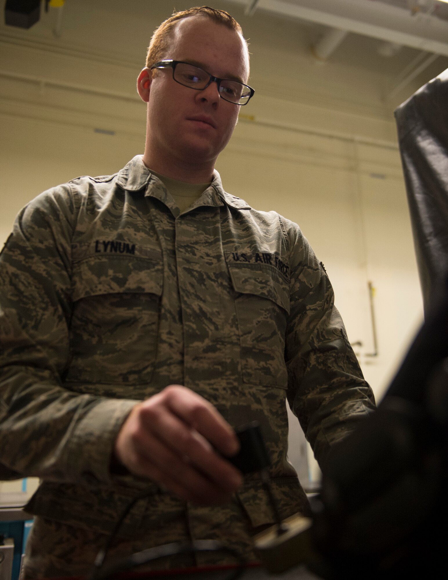 U.S. Air Force Senior Airman David Lynum, 133rd Maintenance Squadron, uses the eddy current bolt hole inspector to find defects within aircraft equipment in St. Paul, Minn., Feb. 26, 2017.