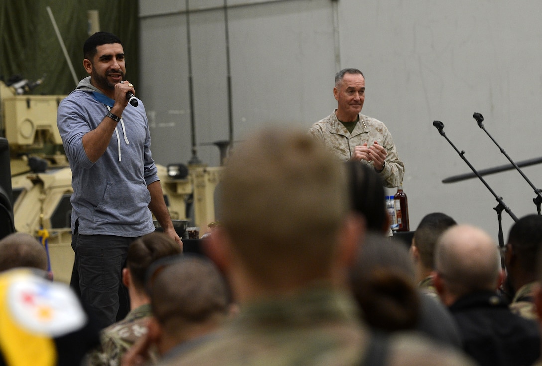 Medal of Honor Recipient Army Capt. (ret.) Florent Groberg, speaks to Bagram Airfield troops during the 2017 Chairman's USO Holiday Tour Dec. 24, 2017 at Bagram Airfield, Afghanistan. Deployed service members, civilians and contractors enjoyed a USO Holiday Tour, featuring actor Adam Devine, comedian Iliza Shlesinger, and WWE Wrestler Alicia Fox, Medal of Honor Recipient Army Capt. (ret.) Florent Groberg, Celebrity Chef Robert Irvine, TNA Wrestler Gail Kim, country singer Jerrod Nieman and WWE wrestler The Miz. (U.S. Air Force photo/Staff Sgt. Divine Cox)