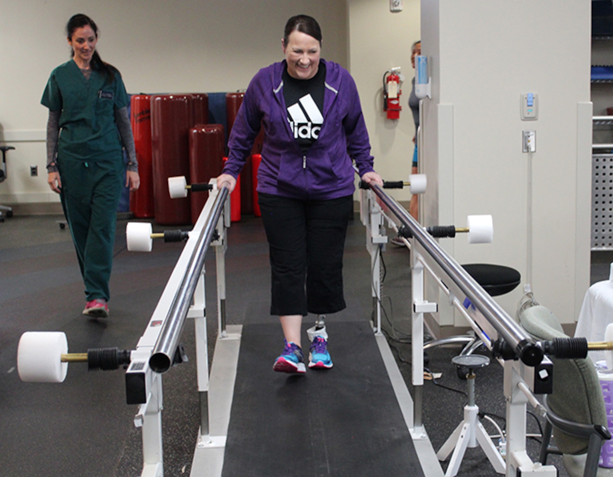 Maj. Stephanie Proellochs, a recent amputee, takes some of her first steps  in her new prosthesis, Nov. 15, 2017. During her physical therapy appointments, Proellochs engages in various exercises to ensure her comfort and safety with walking in a prosthesis. (U.S. Air Force by Karina Luis)