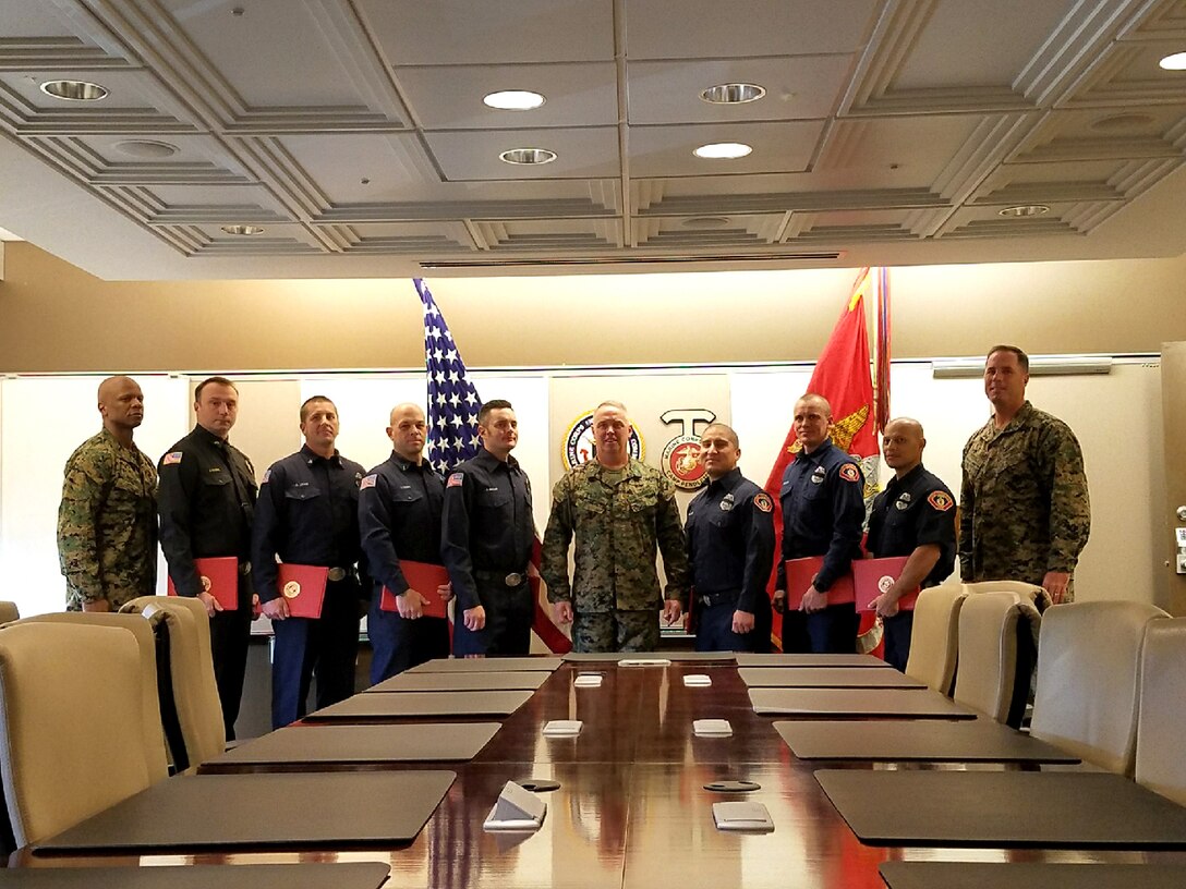 U. S. Marine Corps Brig. Gen. Kevin J. Killea, commanding general, Marine Corps Installations-West, Marine Corps Base Camp Pendleton presented seven firefighters and paramedics with a lifesaving award on Camp Pendleton, Calif., Dec. 19, 2017. Chief Jeff Moore, Captain David Lewis, Engineer Tom Klein, FireFighter Justin Myers and
Firefighter and Paramedics Steve Chavez, Justin Myers, Chris Braun and Lou Santos were awarded for their actions in saving Leeanne Ericson, who was attacked by a shark in April 2017. (Courtesy photo)