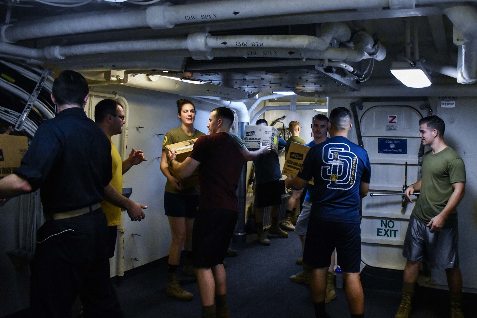 U.S. FIFTH FLEET AREA OF OPERATIONS (Dec. 22, 2017) – Marines and Sailors with USS San Diego and embarked 15th Marine Expeditionary Unit pass boxes during a replenishment at sea. San Diego, with the embarked 15th Marine Expeditionary Unit, is deployed to the U.S. 5th Fleet area of operations in support of maritime security operations to reassure allies and partners and preserve the freedom of navigation and the free flow of commerce in the region.