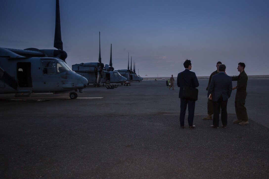 David N. Cicilline, Democratic Representative for Rhode Island’s 1st Congressional District and Mr. Jeffery Tang, control officer, U.S. Embassy Kuwait, speak with Marines from Marine Medium Tiltrotor Squadron 363, Special Purpose Marine Air-Ground Task Force – Crisis Response – Central Command, during a trip to the Middle East Dec. 26, 2017. Cicilline was part of a congressional delegation that visited service members currently forward deployed to learn about their mission and join them for the holidays.