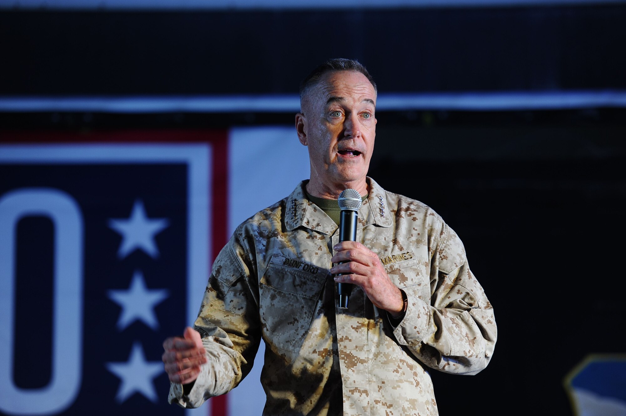 U.S. Marine Corps Gen. Joe Dunford, Chairman of the Joint Chiefs of Staff, speaks with service members assigned to the 380th Air Expeditionary Wing, Al Dhafra Air Base during the Chairman's USO Holiday Tour Dec. 22, 2017.
 Dunford expressed his gratitude towards service members by thanking them for their service to the nation. 

 (U.S. Air Force photo by Tech. Sgt. Anthony Nelson Jr.)