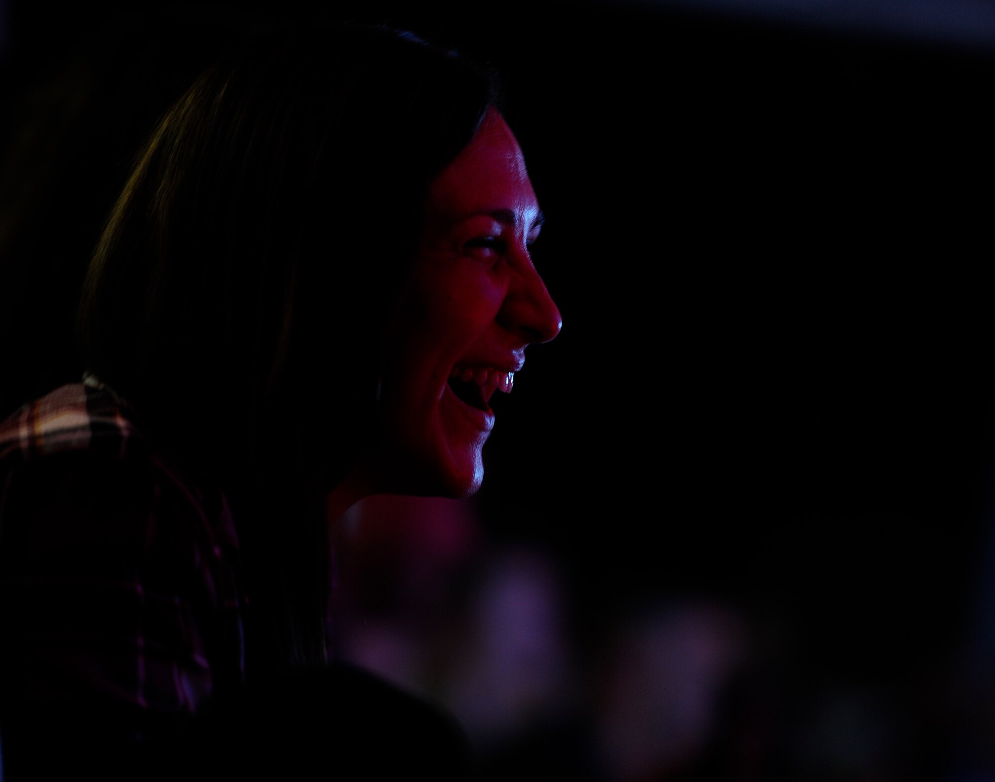 A service member currently deployed to the 380th Air Expeditionary Wing, Al Dhafra Air Base, United Arab Emirates laughs during Comedian Lliza Shlesinger's comedy performance during the 2017 Chairman's USO Holiday Tour Dec. 22, 2017.
U.S. Marine Corps Gen. Joe Dunford, chairman of the Joint Chiefs of Staff, host this tour to spread holiday cheer to service members deployed and stationed overseas.  
  

(U.S. Air Force photo by Tech. Sgt. Anthony Nelson Jr.)