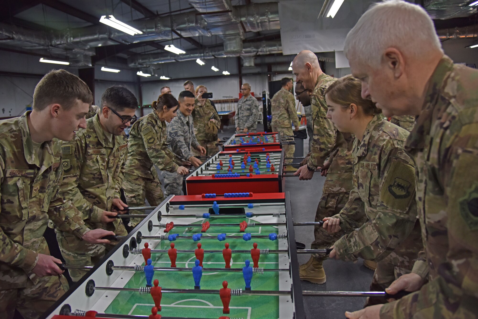 U.S. Air Force Lt. Gen. Scott Rice, Air National Guard director, plays foosball with 407th Expeditionary Force Support Squadron personnel at the 407th Air Expeditionary Group in Southwest Asia, Dec. 25, 2017. The visit gave Rice and Anderson and opportunity to spend Christmas with deployed Airmen. (U.S. Air Force photo by Staff Sgt. Joshua Edwards/Released)