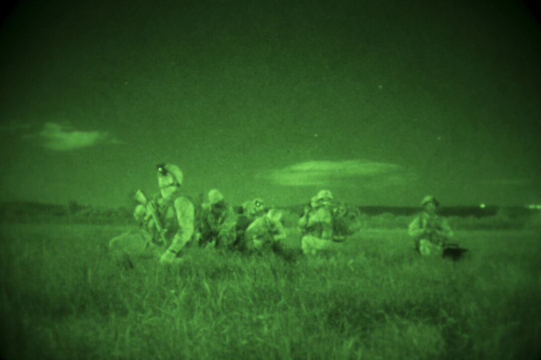 U.S. Marines with Special Purpose Marine Air-Ground Task Force-Crisis Response-Africa simulate a tactical recovery of aircraft and personnel at Naval Air Station Sigonella, Italy, Dec. 4, 2017. SPMAGTF-CR-AF is deployed to conduct limited crisis-response and theater-security operations in Europe and North Africa. (U.S. Marine Corps photo by Sgt. Takoune H. Norasingh/Released)