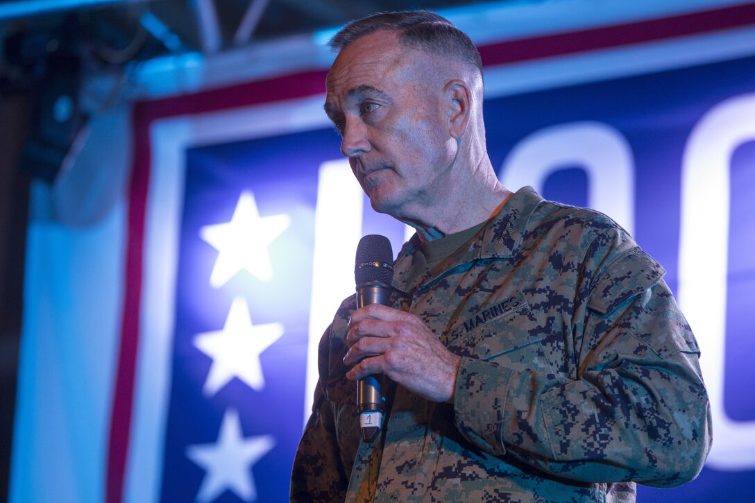 The Chairman of the Joint Chiefs of Staff, U.S. Marine Corps Gen. Joseph Dunford, talks with service members during a USO visit featuring Joint Chiefs of Staff and celebrities to Morón Air Base, Spain, Dec. 21, 2017. For more than 75 years, the USO has provided a vital connection between service members, their families and the American people. (U.S. Marine Corps photo by Sgt. Takoune H. Norasingh/Released)