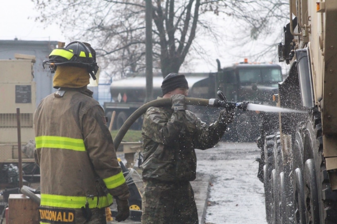 Firefighters from the 23rd Ordnance Company supplement vehicle and equipment cleaning for the 497th Combat Sustainment Support Battalion’s customs clearance and agricultural inspections as they prepare to return to the United States in Powidz, Poland.