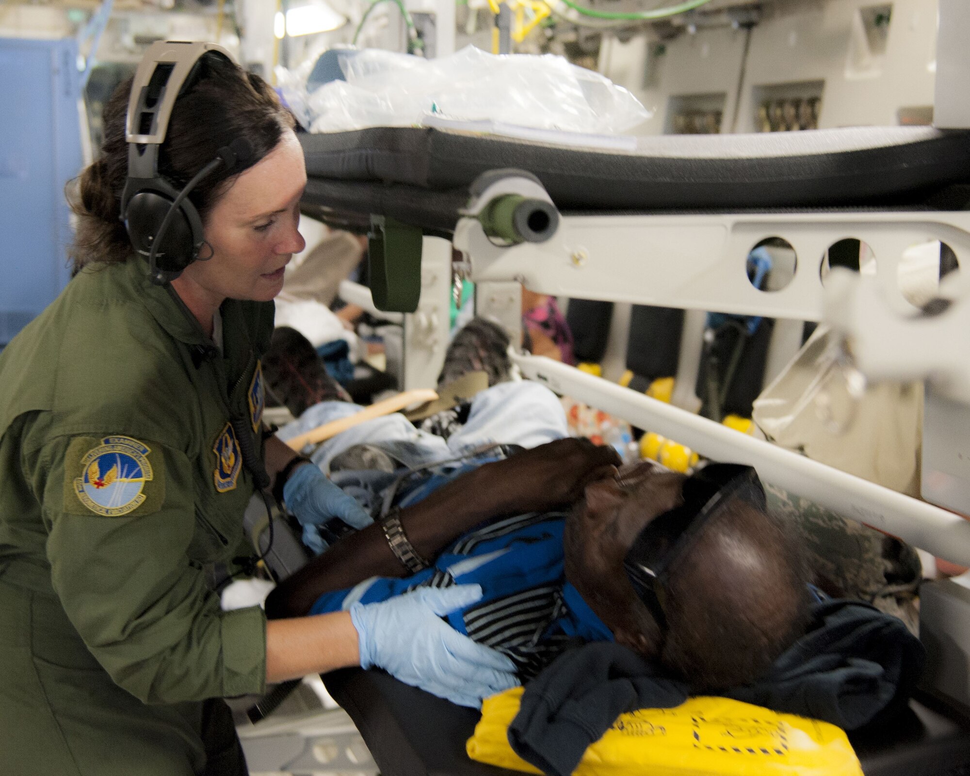 U.S. Air Force Master Sgt. Mary-Beth Young, assigned to the 45th Aeromedical Evacuation Squadron, tends to patients aboard a C-17 Globemaster III while enroute from St. Croix to Dobbins Air Reserve Base, Ga., Sept. 24, 2017. Reserve Citizen Airmen conduct humanitarian mission to St. Croix to evacuate victims affected by Hurricane Maria. (U.S. Air Force photo by Tech. Sgt. Peter Dean)