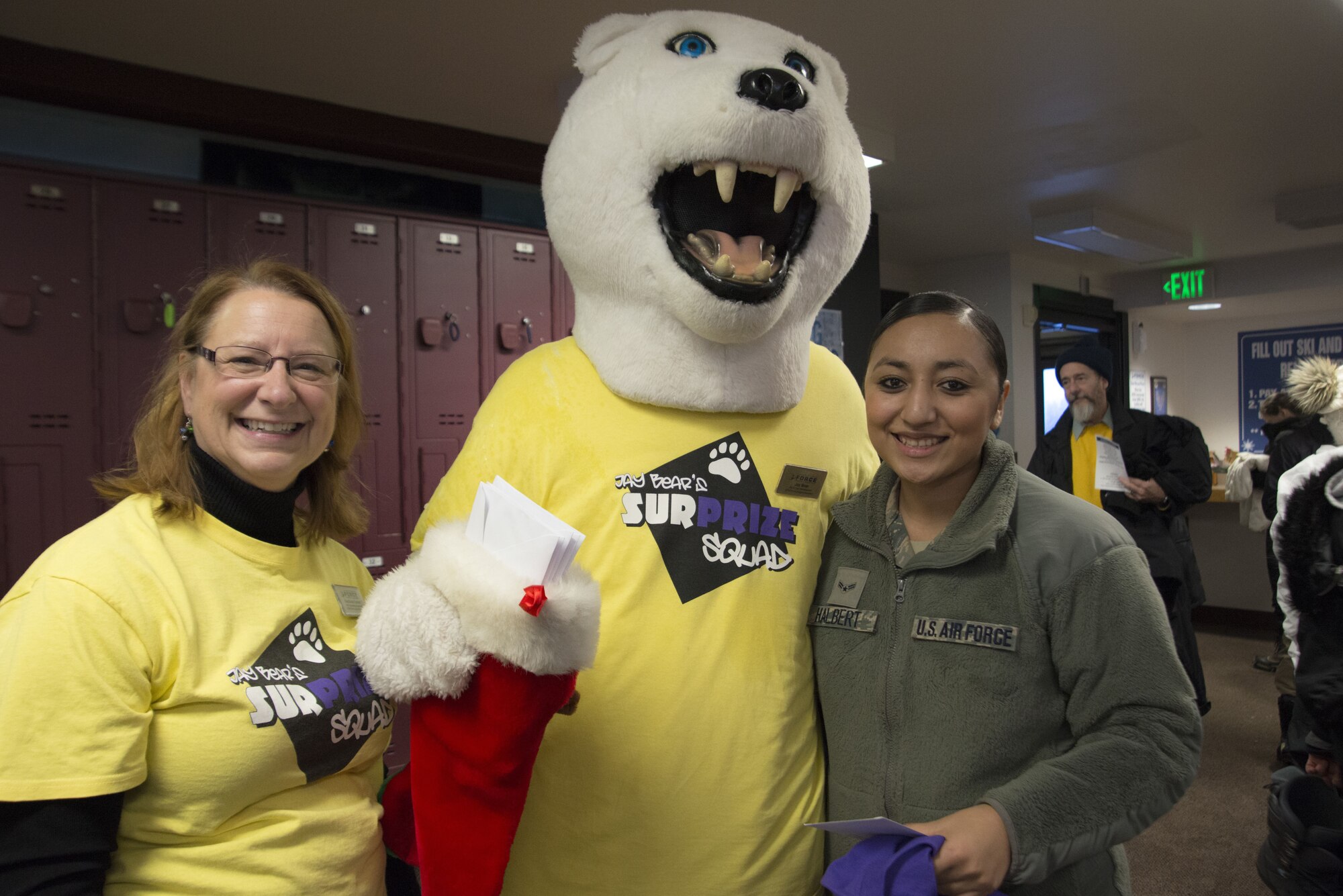 Airman 1st Class Valerie Halbert (right), 673d Air Base Wing Public Affairs photojournalist, receives a $200 gift card from the Jay Bear’s SurPrize Squad at the Hillberg Ski Area during Winterfest at Joint Base Elmendorf-Richardson, Alaska, Dec. 21, 2017. Winterfest was a winter solstice celebration hosted by Hillberg for anyone with base access and offered a plethora of events from noon to as late at 8 p.m.