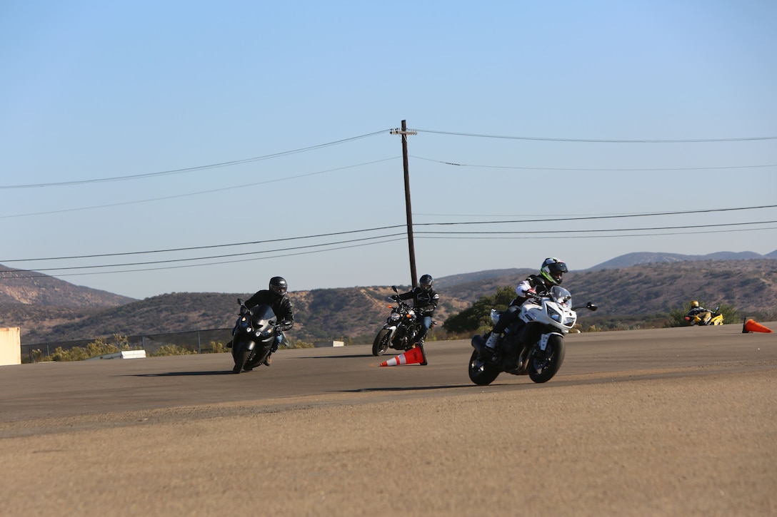 Marines practice turns while riding  motorcycles during the Yamaha Champions Riding School safety course at Marine Corps Air Station Miramar, Calif., Dec. 19. Instructors with the school emphasized “safety over speed” during the advanced safety and skills motorcycle course.  (U.S. Marine Corps photo by Cpl. Victor Mincy/Released)