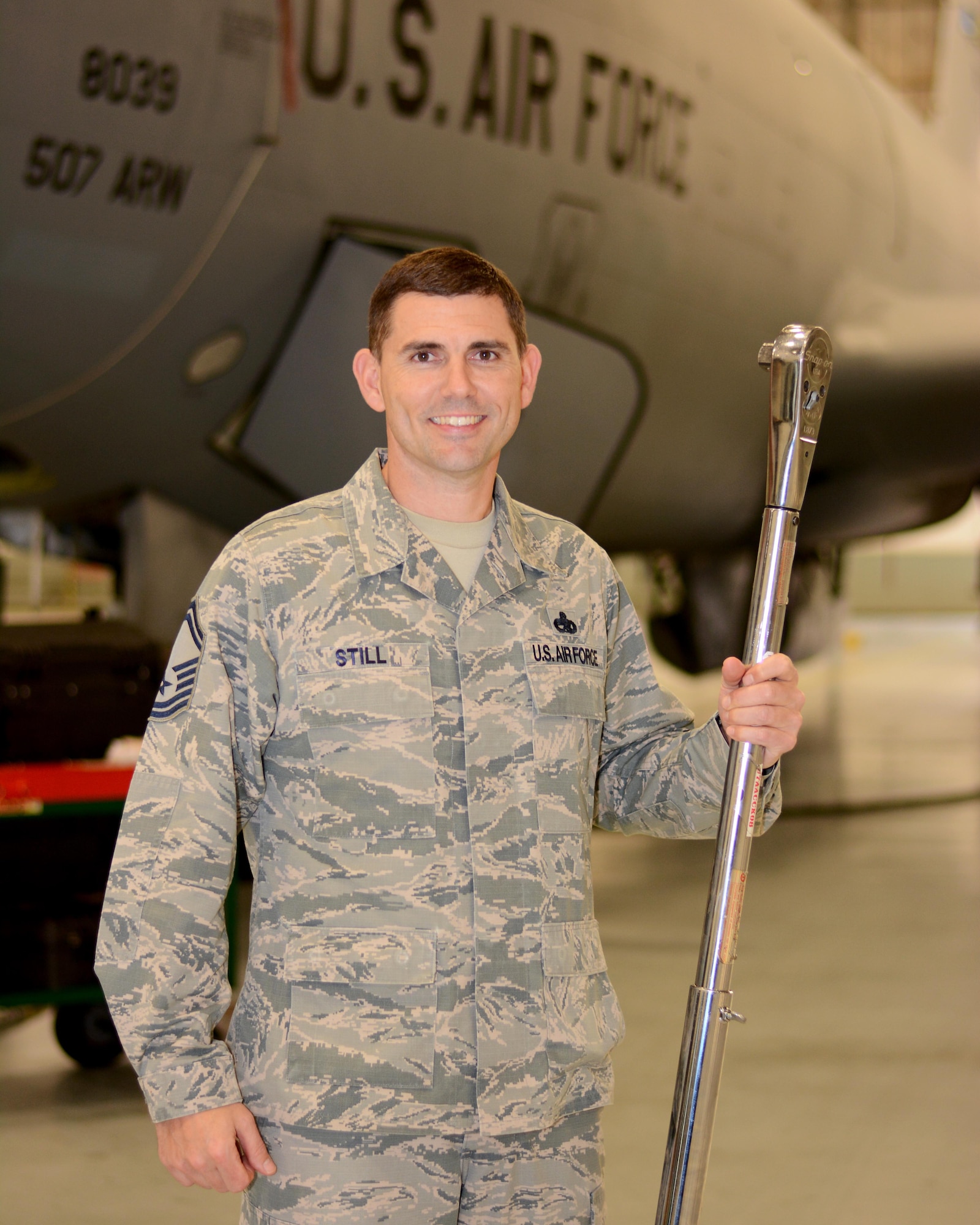 Senior Master Sgt. Corey Still, 507th Aircraft Maintenance Squadron aircraft maintenance unit superintendent, wields a torque wrench while posing for a photo Dec. 20, 2017, at Tinker Air Force Base, Okla. Still provided lifesaving assistance to a motorcyclist following a vehicle accident in November 2017. (U.S. Air Force photo/Tech. Sgt. Lauren Gleason)