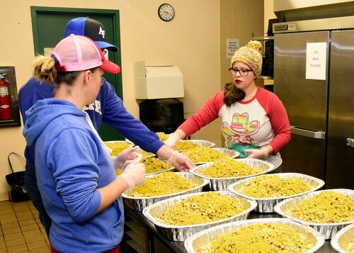Members of the Montana Air National Guard prepare pans of dressing at the 120th Airlift Wing Dining Facility at the Great Falls International Airport in Great Falls, Montana Dec. 24, 2017. The guard personnel volunteered to prepare the dressing, 50 turkeys and gravy and delivered the food to the Great Falls Senior Citizen Center to be served during the 25th Annual Danny Berg Memorial Christmas Dinner. (U.S. Air National Guard photo/Senior Master Sgt. Eric Peterson)