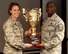 Col. Sonkiss, 62nd Airlift Wing commander, left, presents Master Sgt. Benjamin Harrison, 4th Airlift Squadron first sergeant, with the Healthy Squadron Award trophy Dec. 13, 2017, at Joint Base Lewis-McChord, Washington.