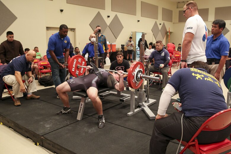 Lance Cpl. Bryce Collins makes his first attempt at bench press during the Foster Powerlifting Competition Dec. 17 at the Community Center aboard Camp Foster, Okinawa, Japan. Athletes from the local and military communities participated in squat, bench press and deadlift events during the competition. Certified Okinawa powerlifting officials ensured the competition was up to the International Powerlifting Federation standards. Collins is a telephone systems personal computer repairer with 3rd Maintenance Battalion, Combat Logistics Regiment 35, 3rd Marine Logistics Group, III Marine Expeditionary Force.  (U.S. Marine Corps photo by Pvt. Nicole Rogge)