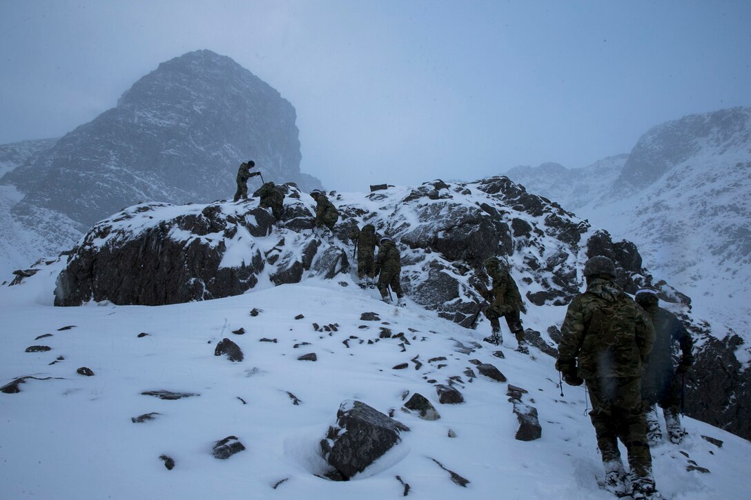 U.S. Marines with Marine Rotational Force Europe (MRF-E) hike Torridon Skyline Mountain alongside the French Marines during exercise Green Claymore in Beinn Liath Mor, Scotland, Nov. 28, 2017. Green Claymore is a pre-Arctic training course lead by the British Royal Marines, designed to improve mountaineering and cold-weather survival skills. (U.S. Marine Corps photo by Cpl. Careaf L. Henson/Released)
