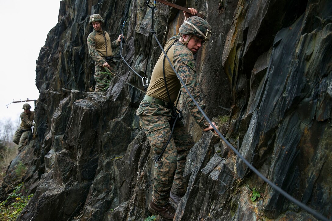 U.S. Marines with Marine Rotational Force Europe (MRF-E) participate in a rock climbing training event alongside the French Marines during exercise Green Claymore in Ballachulish Quarry, Scotland, Dec. 02, 2017. Green Claymore is a pre-Arctic training course lead by the British Royal Marines, designed to improve mountaineering and cold-weather survival skills. (U.S. Marine Corps photo by Cpl. Careaf L. Henson/Released)