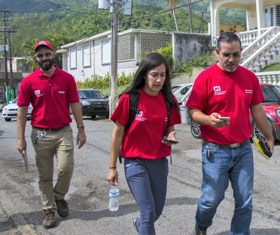 Tom Carriveau (left), Yamiretsy Pagan and Omar Esquilin-Mangual wrap up a town hall meeting in Villalba, Puerto Rico, on Dec. 14, 2107. The event was organized for the residents of Villalba to understand FEMA programs to include Small Business Administration, Infrastructure Assessment and Operation Blue Roof.