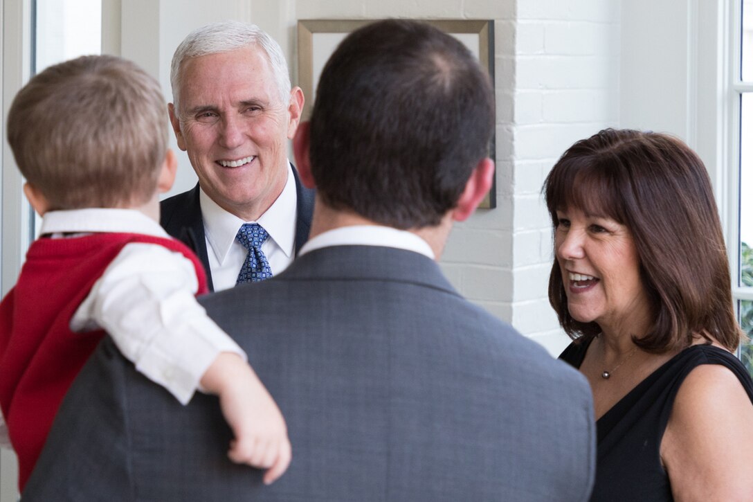 Vice President Mike Pence and Second Lady Karen Pence welcome a man and his son to the Naval Observatory.