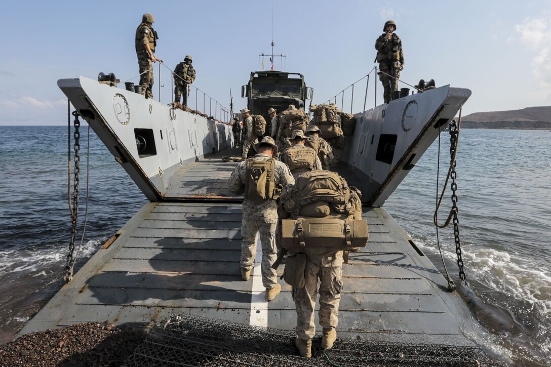 Marines board a ship.