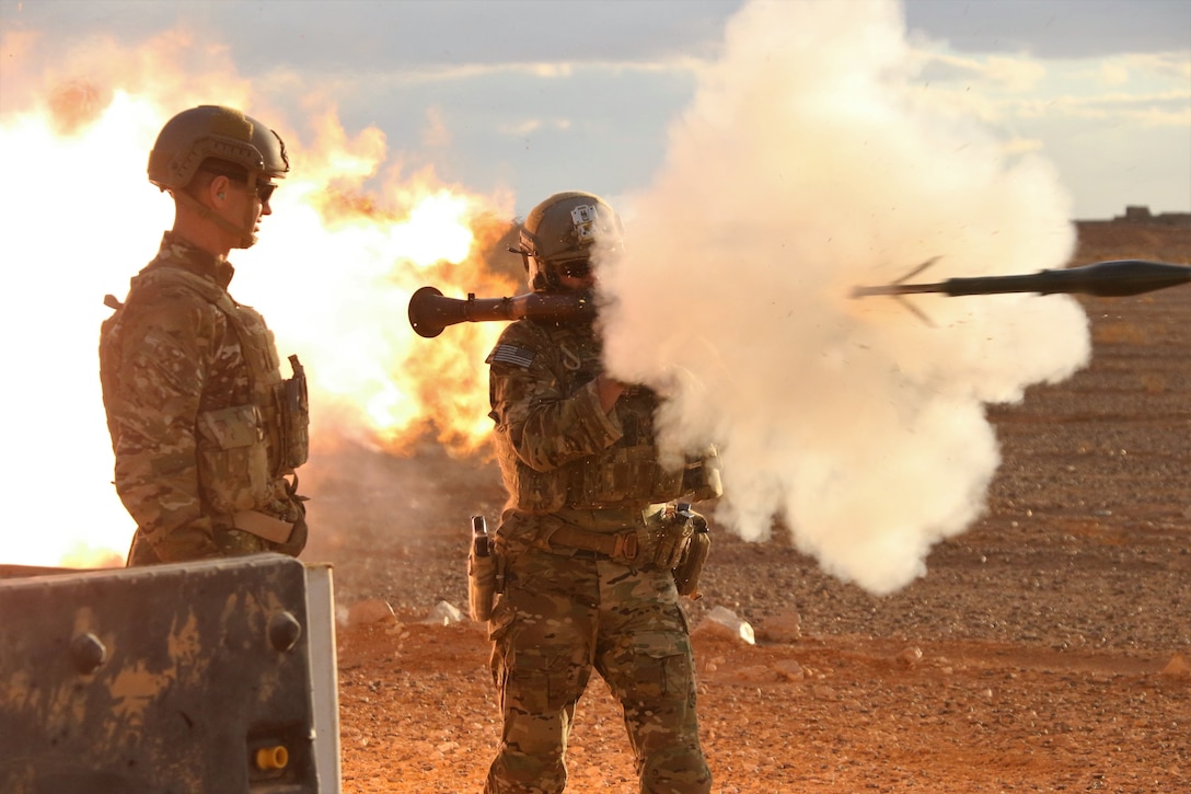 U.S. Army Maj. Gen. James Jarrard, left, the commander of Special Operations Joint Task Force-Operation Inherent Resolve, provides assistant gunner support to a member of the 5th Special Forces Group during counter ISIS operations in southern Syria Nov. 22, 2017. (U.S. Army photo by Staff Sgt. Jacob Connor)