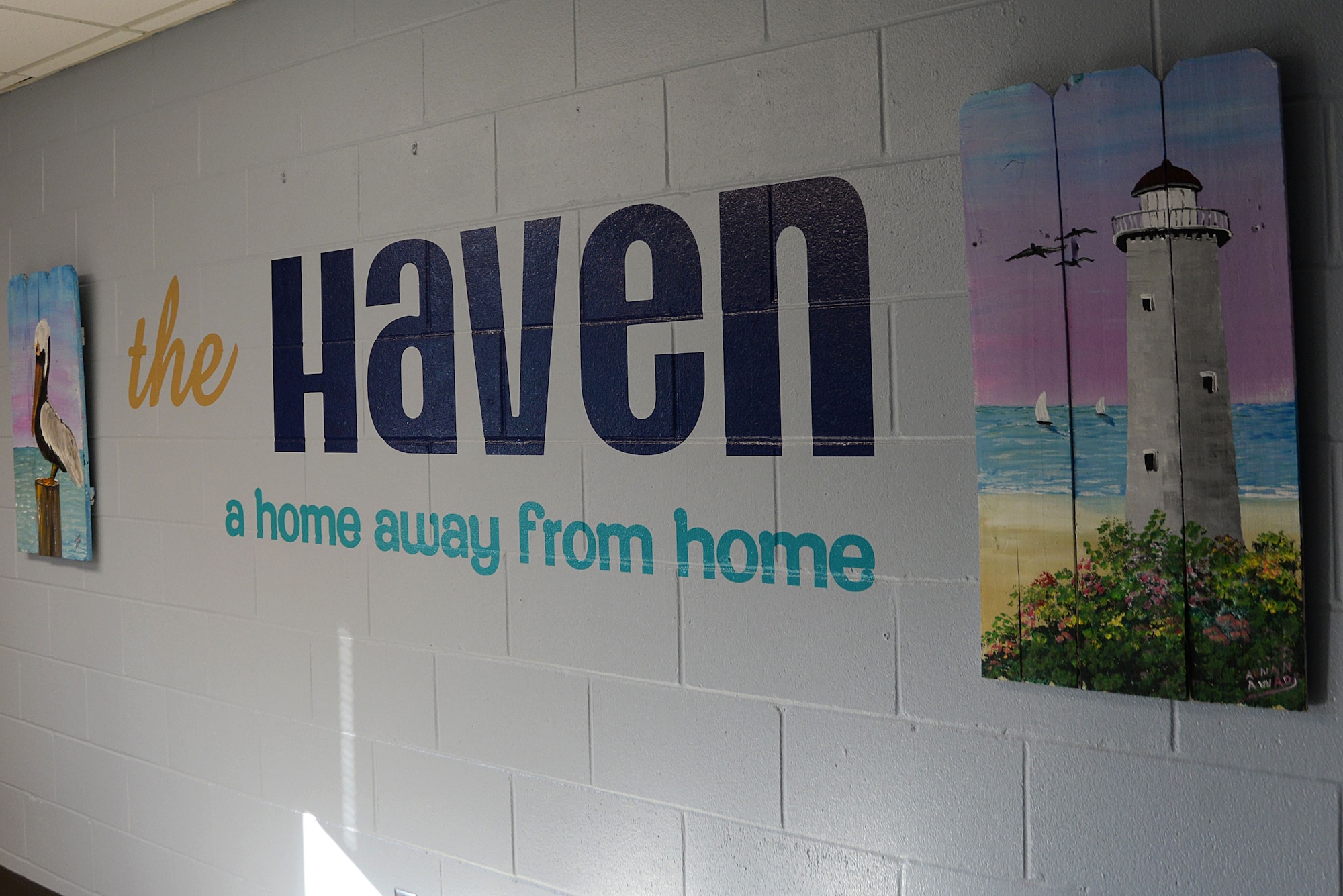 Paintings and a mural are displayed on the wall of the Haven during the Haven reopening Dec. 21, 2017, on Keesler Air Force Base, Mississippi. The Keesler Five-Six Council helped repaint the Haven and bought decorations to improve the dorm common area for Keesler’s dorm residents. (U.S. Air Force photo by Airman 1st Class Suzanna Plotnikov)