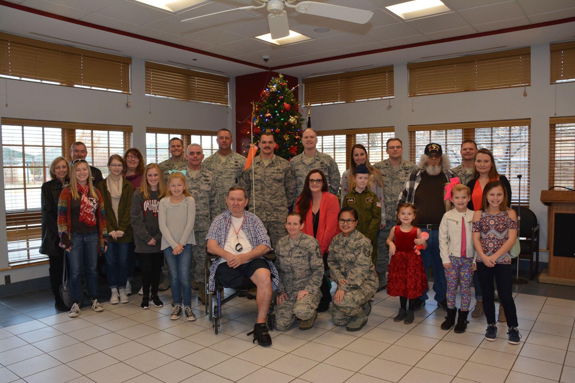 Members of the 507th Air Refueling Wing at Tinker Air Force Base, Okla., visit the Norman Veterans Center Dec. 21, 2017, to spread holiday cheer with residents in Norman, Okla. For 22 years, the 507th ARW has sponsored veterans during the holidays as part of the Angel Tree program. This year, 28 veterans received nearly 2,000 dollars in gifts from wing members. (U.S. Air Force photo/Tech. Sgt. Lauren Gleason)