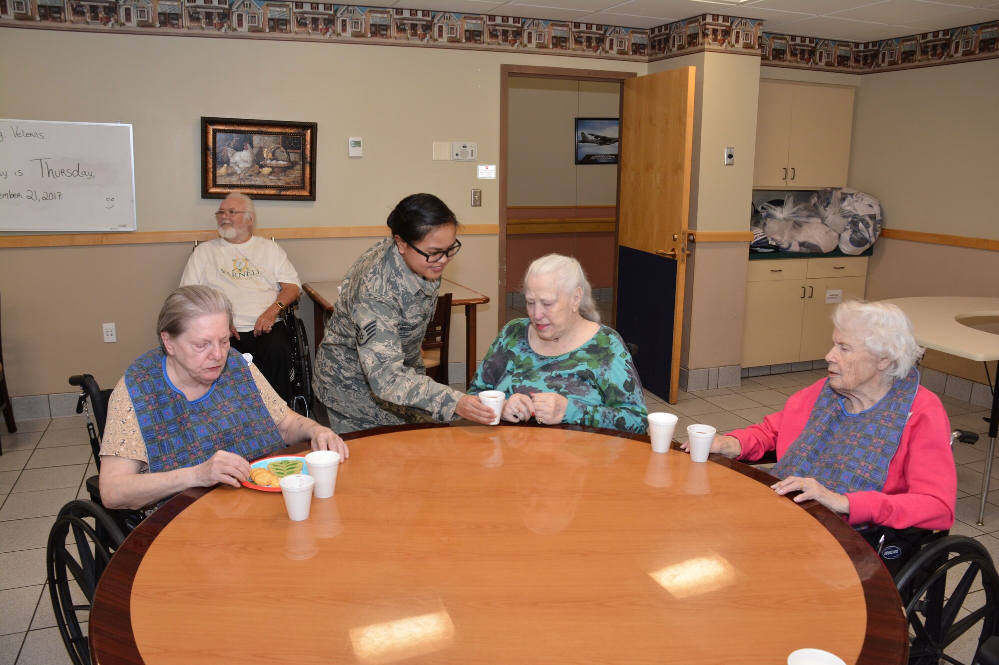 Members of the 507th Air Refueling Wing at Tinker Air Force Base, Okla., visit the Norman Veterans Center Dec. 21, 2017, to spread holiday cheer with residents in Norman, Okla. For 22 years, the 507th ARW has sponsored veterans during the holidays as part of the Angel Tree program. This year, 28 veterans received nearly 2,000 dollars in gifts from wing members. (U.S. Air Force photo/Tech. Sgt. Lauren Gleason)