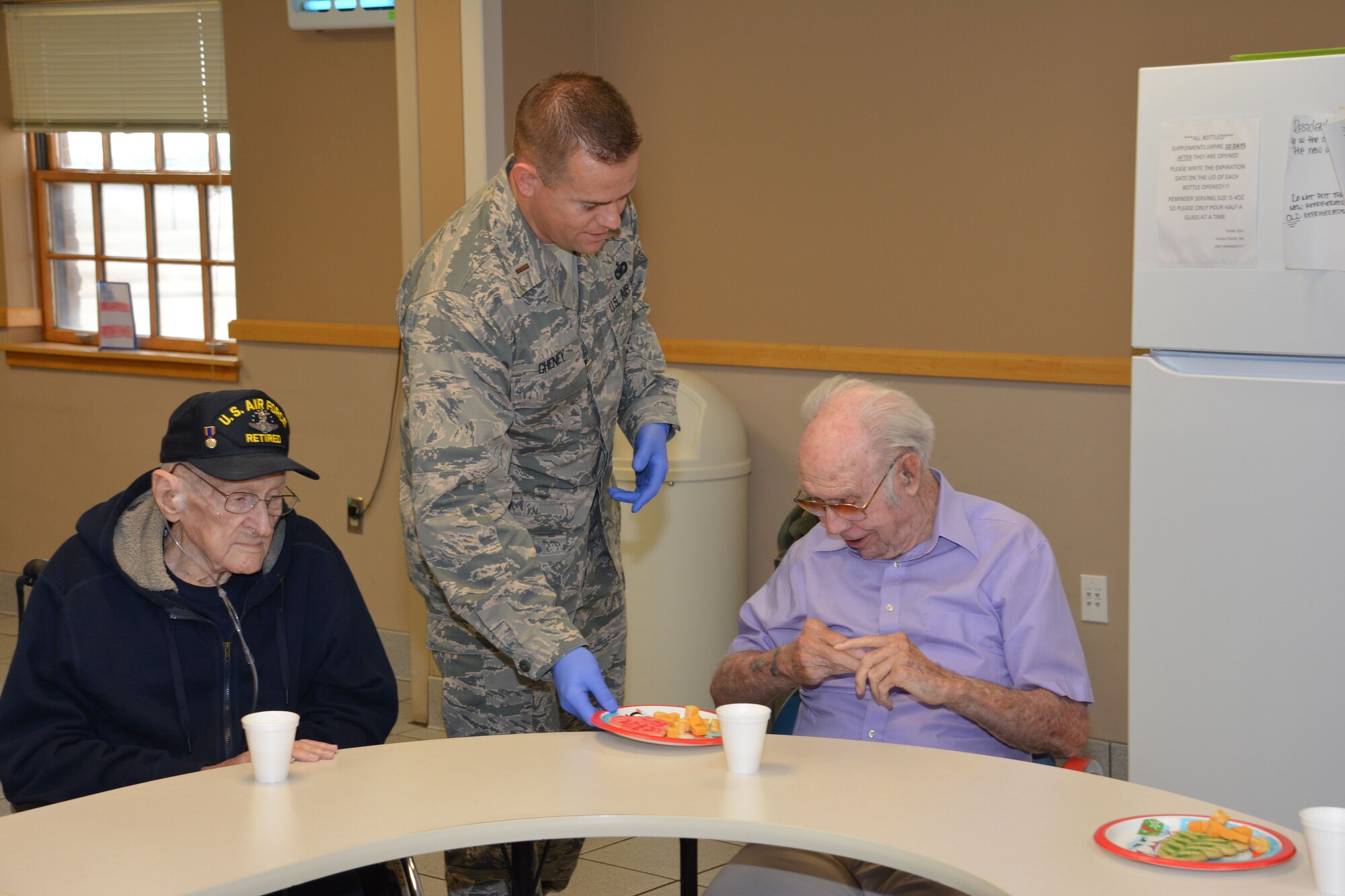 Members of the 507th Air Refueling Wing at Tinker Air Force Base, Okla., visit the Norman Veterans Center Dec. 21, 2017, to spread holiday cheer with residents in Norman, Okla. For 22 years, the 507th ARW has sponsored veterans during the holidays as part of the Angel Tree program. This year, 28 veterans received nearly 2,000 dollars in gifts from wing members. (U.S. Air Force photo/Tech. Sgt. Lauren Gleason)