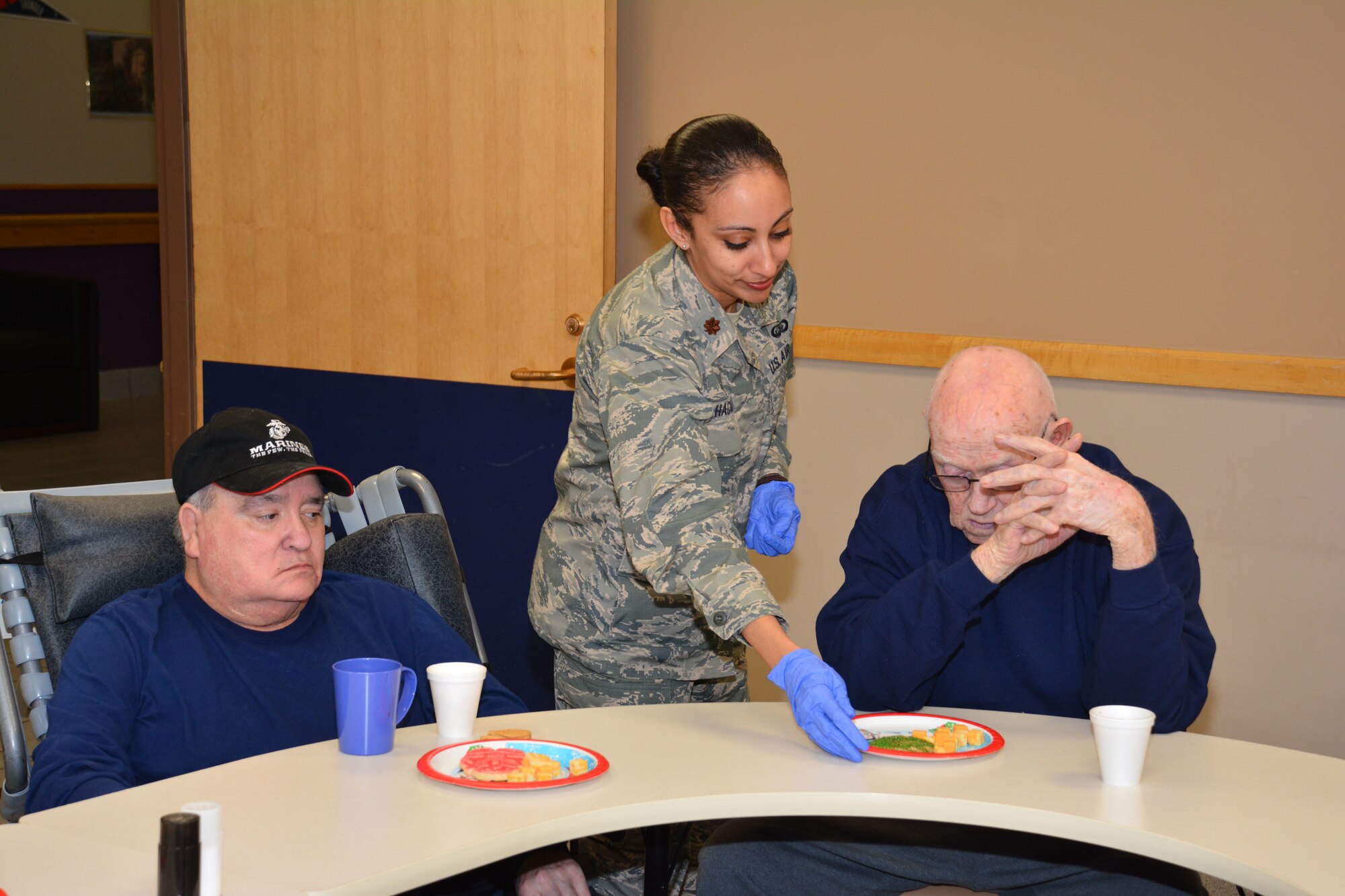 Members of the 507th Air Refueling Wing at Tinker Air Force Base, Okla., visited the Norman Veterans Center Dec. 21, 2017, to spread holiday cheer with residents in Norman, Okla. For 22 years, the 507th ARW has sponsored veterans during the holidays as part of the Angel Tree program. This year, 28 veterans received nearly 2,000 dollars in gifts from wing members. (U.S. Air Force photo/Tech. Sgt. Lauren Gleason)