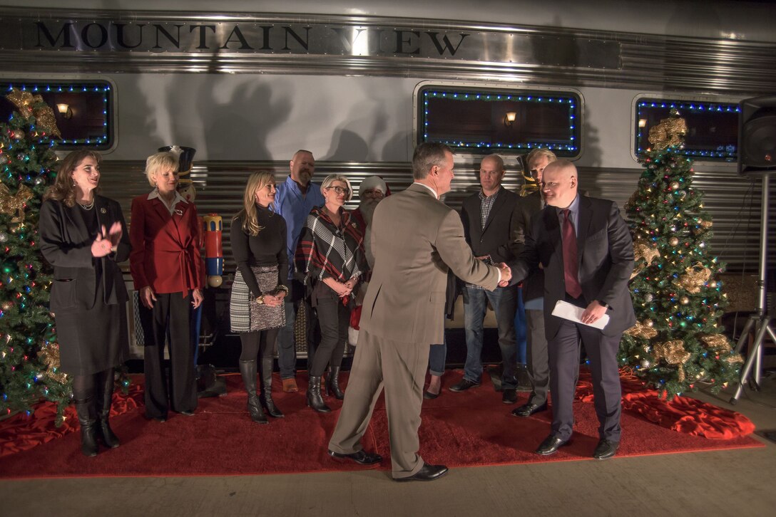 U.S. Air Force Col. Devin Wooden, Commander 137th Special Operations Wing, receives a $10,000 check in support of the wing's non-profit orgranizations from Zac Andersen, Vice Presedent Corporate Relations Burlington North Santa Fe Railway, downtown Oklahoma City, Dec. 1, 2017. The BNSF will donate a total of $50,000 to military organizations that provide support to military members and their families. (U.S. Air National Guard photo by Tech. Sgt.Caroline Essex/Released)