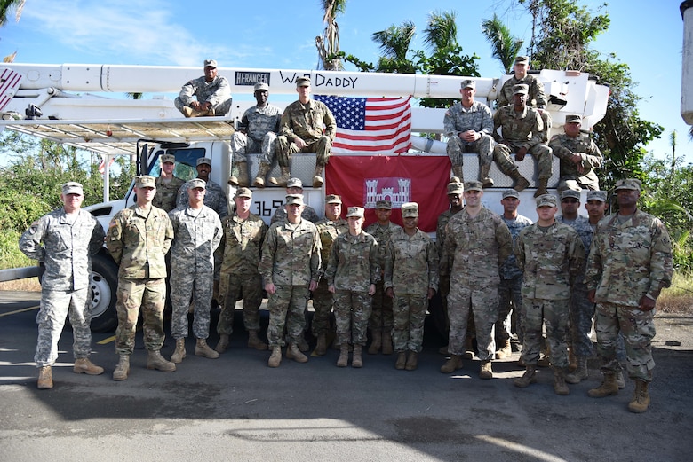 Delta Company, 249th Engineer Battalion Soldiers pose for a group photo USACE South Atlantic Division Commander Brig. Gen. Diana Holland and Task Force Power Restoration Command Col. John Lloyd after an award ceremony highlighting the unit’s successful mission during hurricane recovery operations in Puerto Rico.
