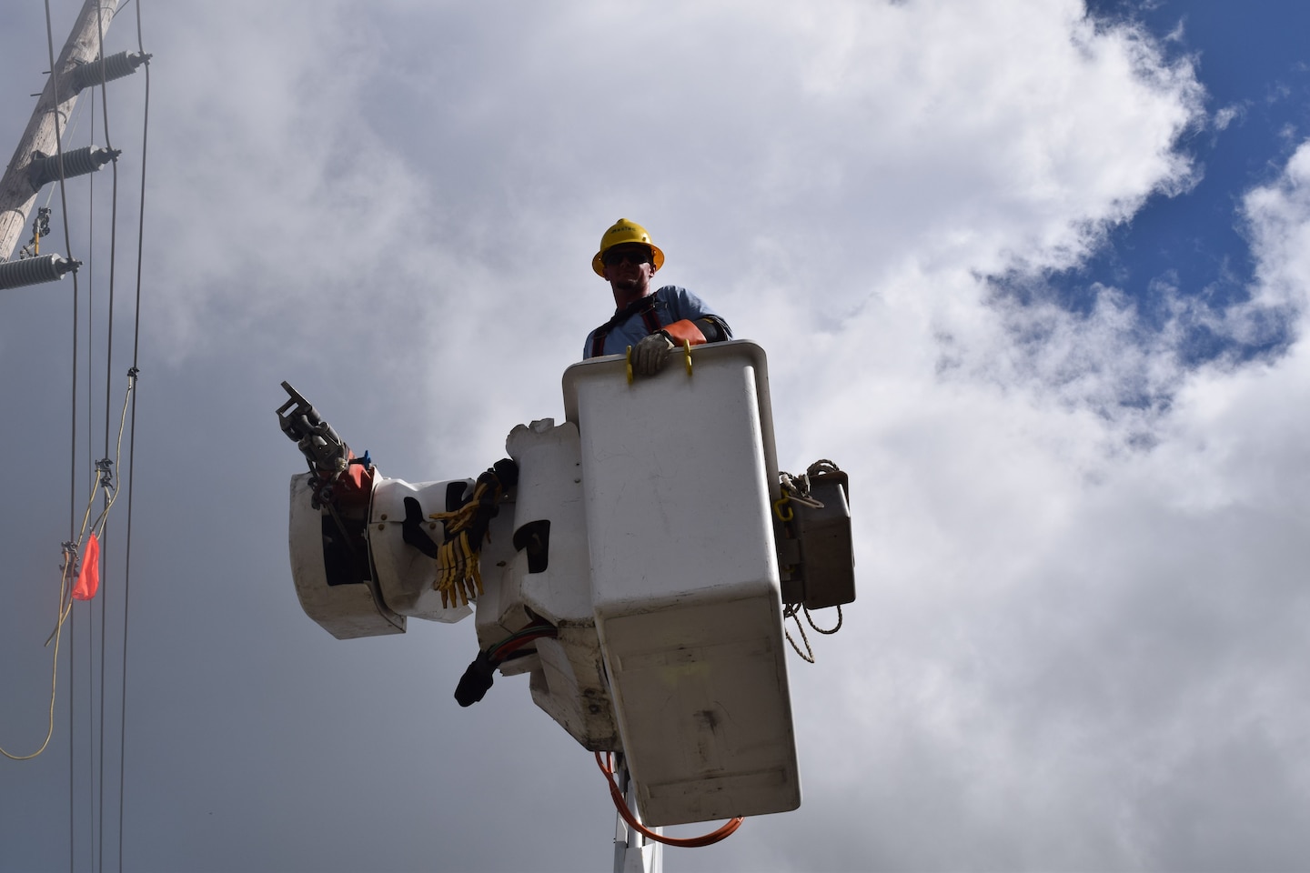The Army Corps of Engineers Task Force Power Restoration continues their mission through the holidays. Corps Quality Assurance Specialist Amy Tillery observes as a contracted crew from Mas-Tec erect transmission lines Christmas morning. Residences and businesses in the area have been without power for over 100 days. Patrick Foreman, a lineman operating an auger pole truck at the construction site, said he was overwhelmed with the people’s kindness. “My whole crew just wants to finish our work here as safely and quickly as possible, so these fine people can return to a normal life.”