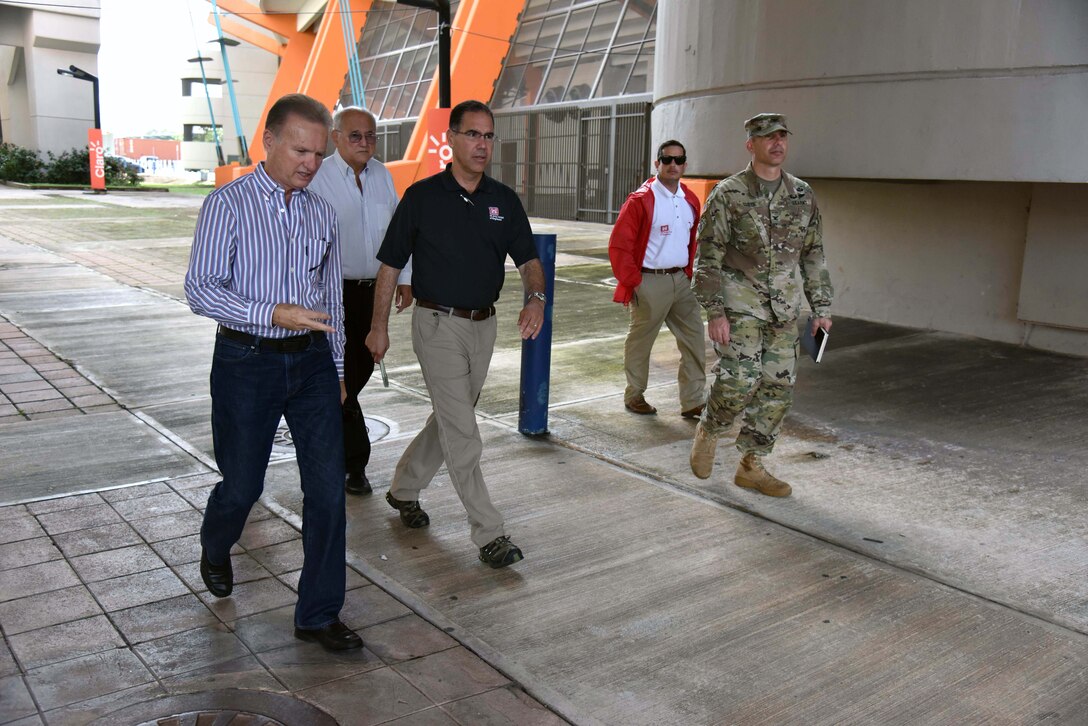 Bayamon City Mayor Ramon L. Rivera Cruz, Attorney Eliezer Aldarondo Ortiz, USACE Puerto Rico Power Grid Program Director Jose Sanchez, Task Force Power Restoration Real Estate Chief Eric Sternberg and TFPR Commander Col. John Lloyd meet Dec. 22 in Bayamon, Puerto Rico, to discuss use of city land space at the Bayamon sports complex for storage of critical materials used in the power restoration mission, including utility poles and other power grid supplies. The city is allowing the Corps use of its property and infrastructure to help expedite delivery of needed power grid supplies and equipment across the island.