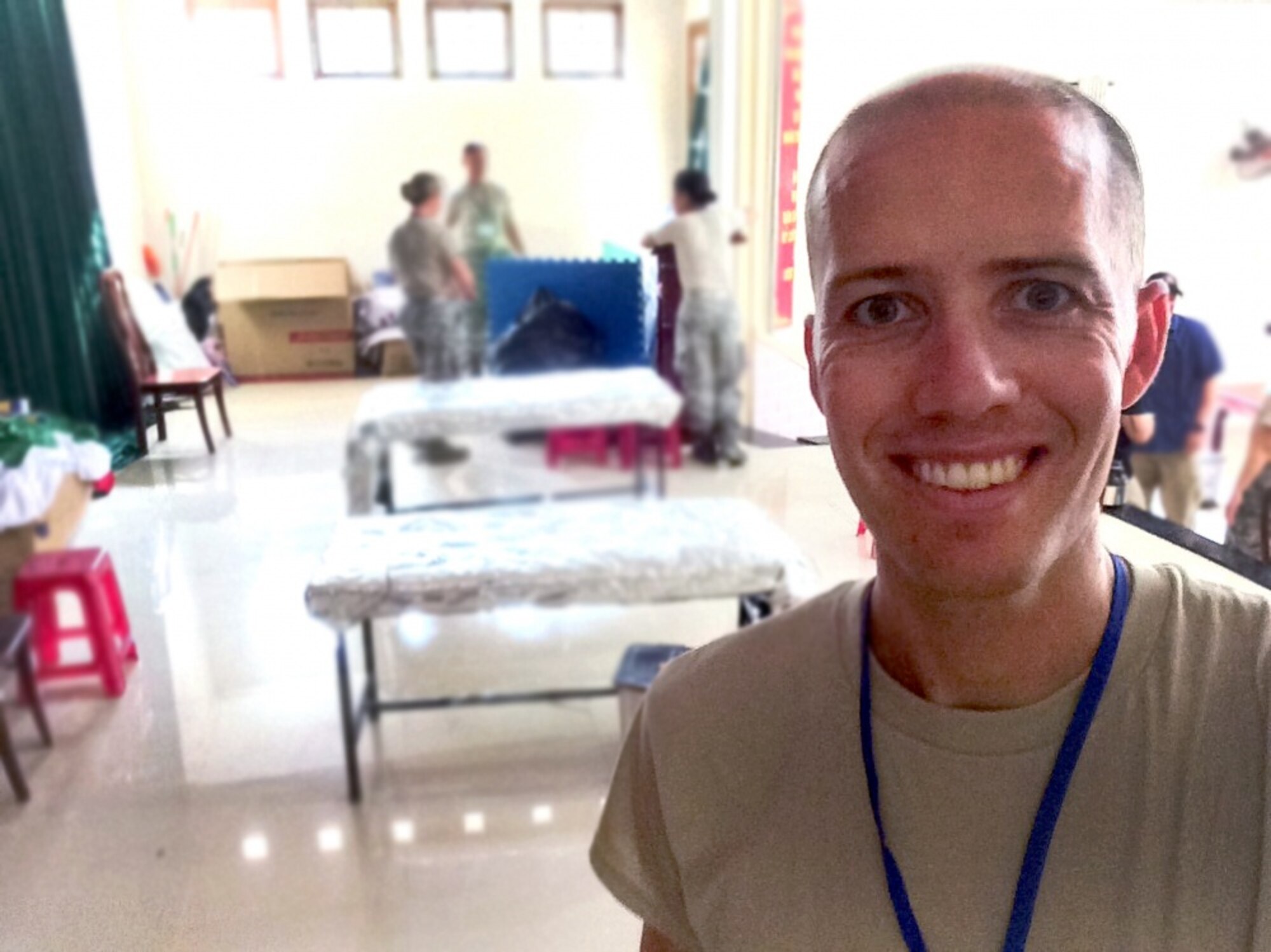 U.S. Air Force Maj. (Dr.) Cody Butler, a physical therapist and commander of the 78th Medical Group Clinical Medicine Flight, poses in the clinic set up in the government community center in Tam Ky, Quang Nam Province, Vietnam, Nov. 30, 2017. Butler was in Vietnam as part of a team seeing patients and building relationships with local physicians during the humanitarian assistance engagement Operation Pacific Angel Vietnam 2017. (U.S. Air Force photo by Jonathan Bell)