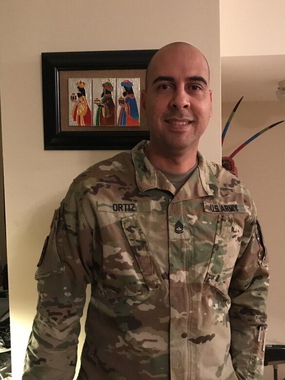 Army Sgt. 1st Class Rafael Ortiz, a cybersecurity noncommissioned officer with the 781st Military Intelligence Battalion, poses for a photo at Fort George G. Meade, Md., Dec. 7, 2017. Ortiz used his personal leave time to cover his 21-day deployment with the Red Cross to assist others after Hurricane Maria struck Puerto Rico, a U.S. territory, on Sept. 20. Courtesy photo
